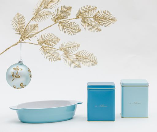 A vertical shot of a bowl and container set and Christmas decorations on a white background