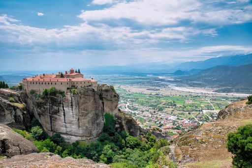 A beautiful shot of an old historic fortress on rock formations in Greece