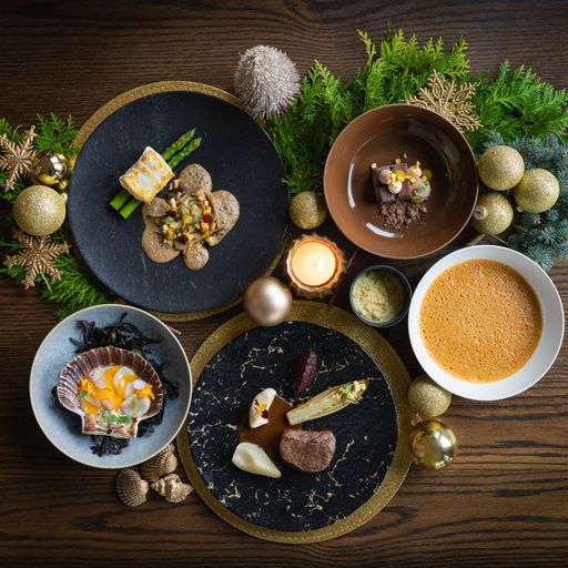 A top view of appetizing food with christmas decorations on a wooden table