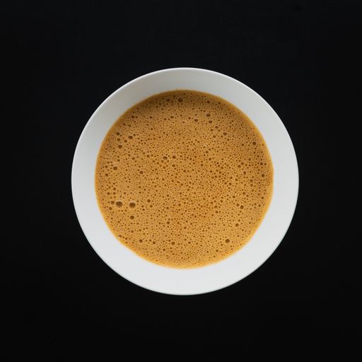 A top view of delicious Thai bisque on black background