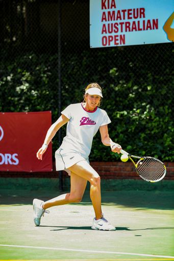 Johannesburg, South Africa - November 10, 2012: Amateur female tennis player practicing on a sunny day