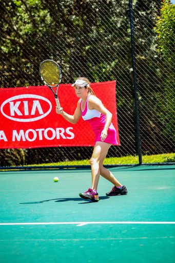 Johannesburg, South Africa - November 10, 2012: Amateur female tennis player practicing on a sunny day