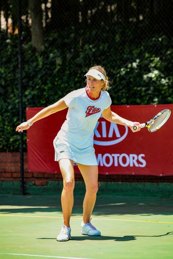 Johannesburg, South Africa - November 10, 2012: Amateur female tennis player practicing on a sunny day