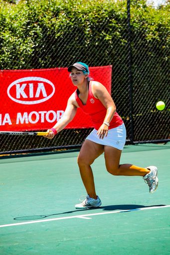 Johannesburg, South Africa - November 10, 2012: Amateur female tennis player practicing on a sunny day