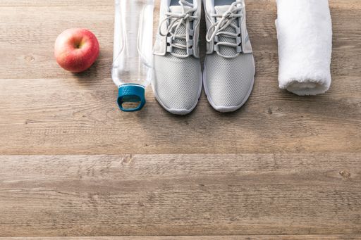 A high angle shot of sports equipment on a wooden surface