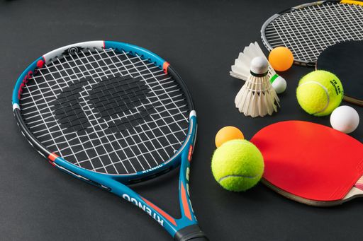 A closeup shot of racket sports equipment on a black surface