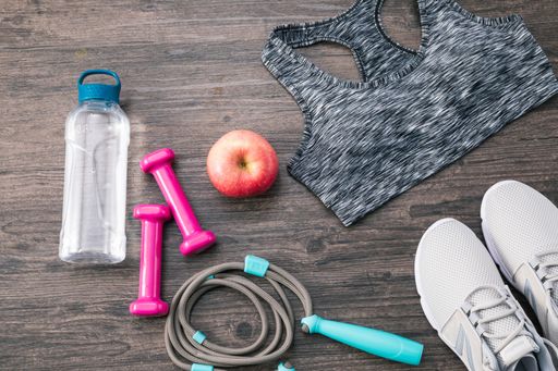 A flat lay of sports equipment on a wooden surface
