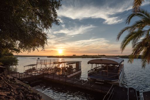 Boats at Chobe river by Chobe Safari Lodge.
Boats are used for sunset cruise on the river where you can see wildlife.