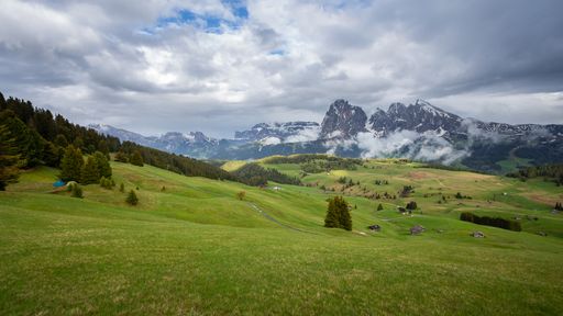 The beautiful Langkofel group gleaming under the cloudy sky in Italy