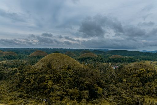 An aerial view of the forested hills on a cloudy day