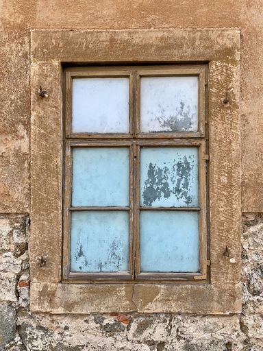An old window of an old abandoned building