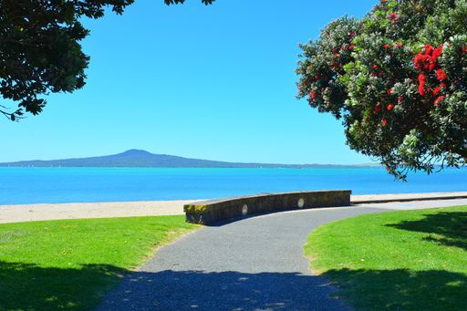 View of St Heliers Bay beach with Rangitoto Island in background