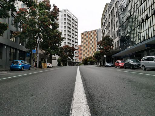 Low angle view up Anzac Avenue without traffic from center line