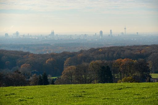 A panoramic shot at the hazy Cologne Skyline from an elevated standpoint in Rheingraben, Rhine valley