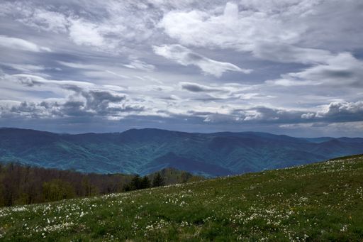 A beautiful green mountainous scenery under the gloomy sky
