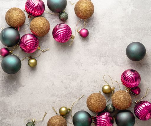 A beautiful Christmas corners background with bronze, purple, and gray balls on a grunge surface with a copy space