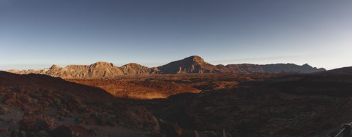 A panoramic shot of a mountainous scenery under the clear sky