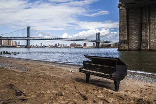 old piano on the beach in Manhattan. NYC.