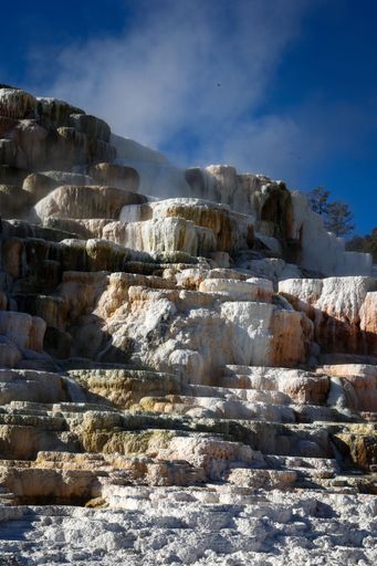 Terraced rock formations and clay deposits in Mammoth Hot Springs, Yellowstone National Park, Wyoming