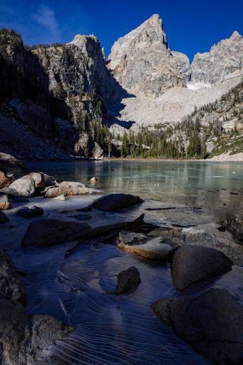 The Delta Lake at Grand Teton National Park, Wyoming in the foreground of a mountain range