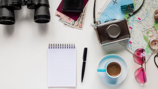 A high angle shot of traveling objects on a white surface