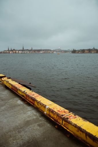 A vertical high angle shot of  a sea under the gloomy sky in Stockholm, Sweden