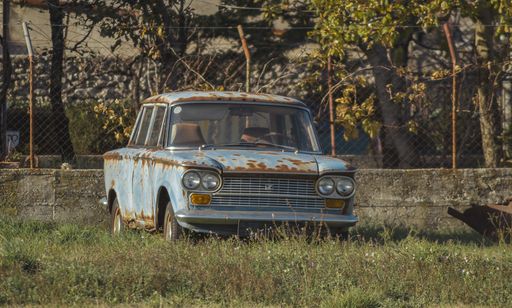 Old rusty zastava 1300, is a vintage yugoslavian car from 1970's made under Fiat licence