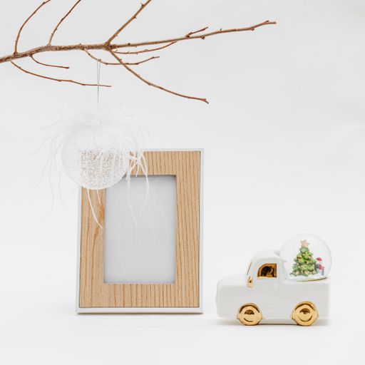 Beautiful Christmas decoration with a photo frame isolated on a white background