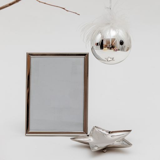 Beautiful Christmas decoration with a photo frame isolated on a white background