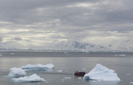 A boat floating on the water in Paradise harbor, Antarctica