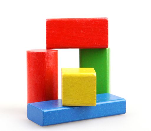A set of colorful wooden building blocks isolated on a white background