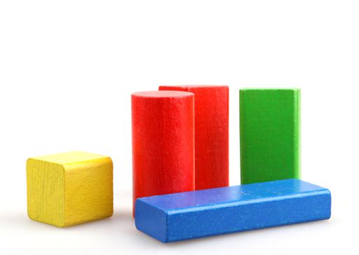 A set of colorful wooden building blocks isolated on a white background