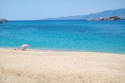 Naxos island Greece. Secluded beach at the small charming village of Mikri Vigla on the south west coast. Idyllic summer scene, white sand, blue sea. 