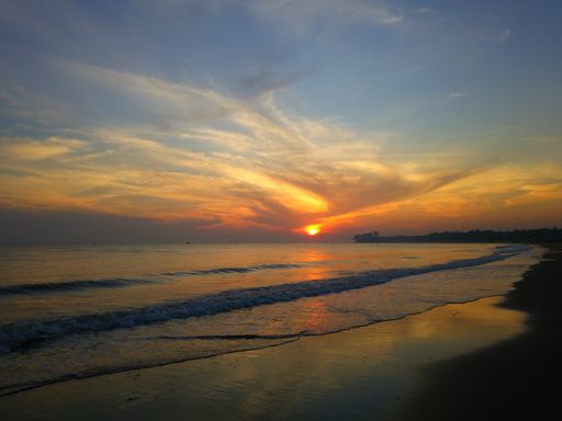 A high angle shot of a sandy beach captured during the sunset