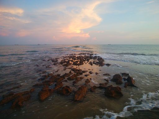 A high angle shot of the rocky beach captured during the daytime