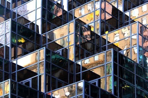 A low angle  shot of a creative modern building with outstanding architectural twists