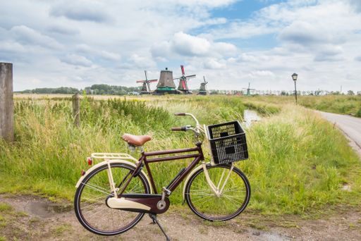 A closeup shot of a Bicycle in Zaanse Schans, Netherlands under the cloudy sky