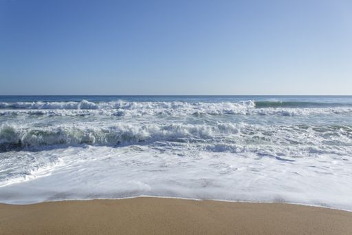 A mesmerizing view of the Costa Brava on a sunny day under the cloudy sky