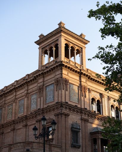 A vertical shot of the beautiful facade of an old building on a sunny day