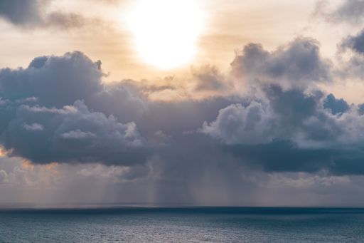Dark clouds over ocean horizon