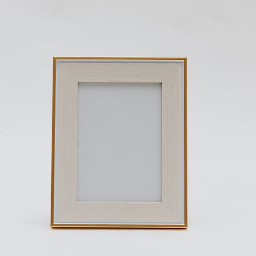 A vertical shot of a wooden photo frame on an isolated white background