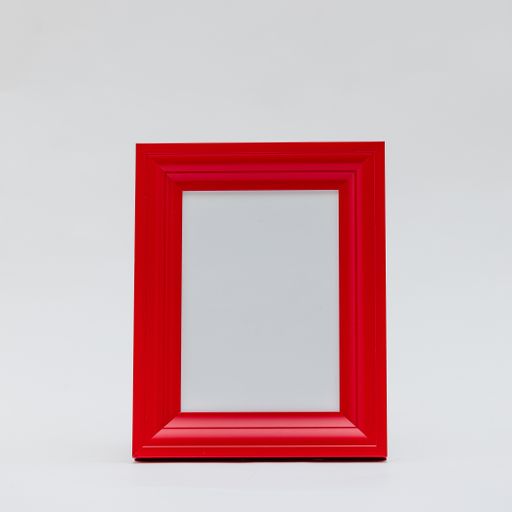 A vertical shot of a red photo frame on an isolated white background