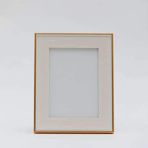 A vertical shot of a wooden photo frame on an isolated white background