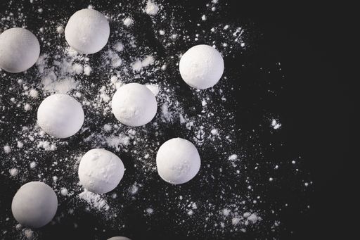A top view shot of Chinese sweet dumplings on black background
