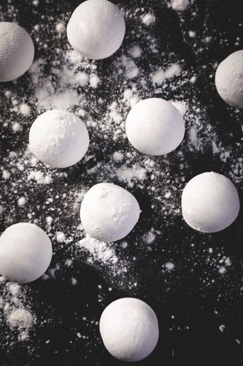 A top view shot of Chinese sweet dumplings on black background