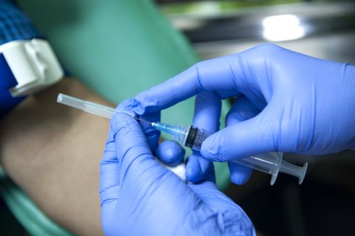 A selective focus shot of vaccination against coronavirus - concept of new normal