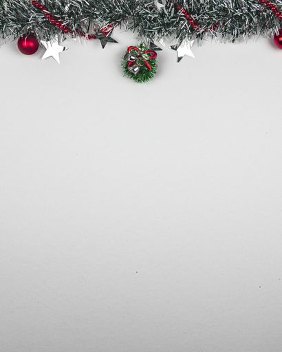 A vertical shot of beautiful Christmas decorations on white background with a copy space
