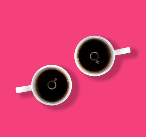 A top view of  coffee cups with bubbly gender symbols on them  on a pink background