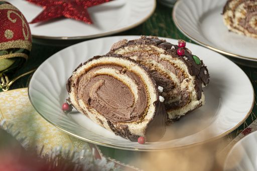 A selective focus shot of a delicious Christmas sponge cake slices