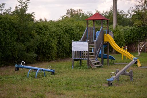 A playground for children on a yard of a primary school in a village